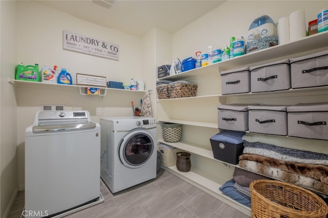 laundry room featuring separate washer and dryer