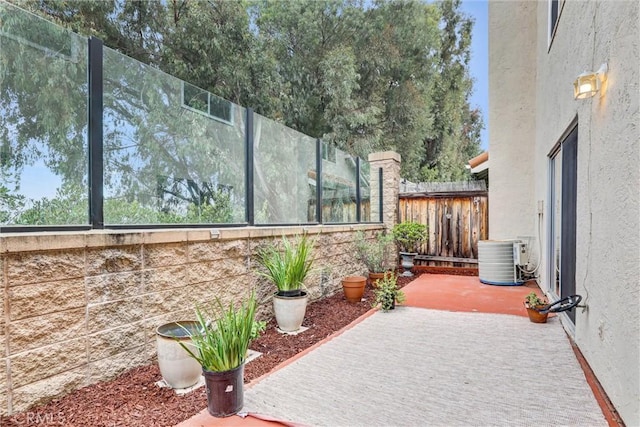 view of patio with central AC unit