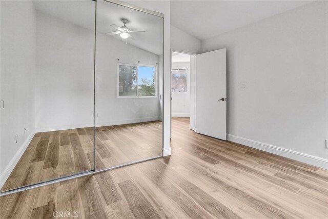 16096 Caminito Tomas, San Diego, CA 92128 - unfurnished bedroom with lofted ceiling, wood finished floors, a closet, and ceiling fan