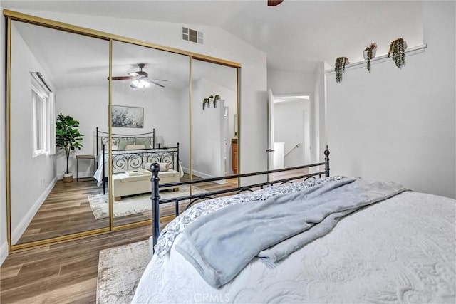 16096 Caminito Tomas, San Diego, CA 92128 - bedroom with lofted ceiling, wood finished floors, a closet, and ceiling fan