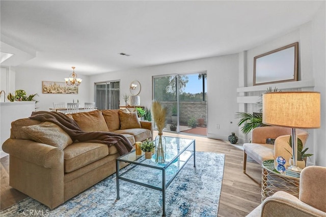 16096 Caminito Tomas, San Diego, CA 92128 - living area with a chandelier and light wood-style floors