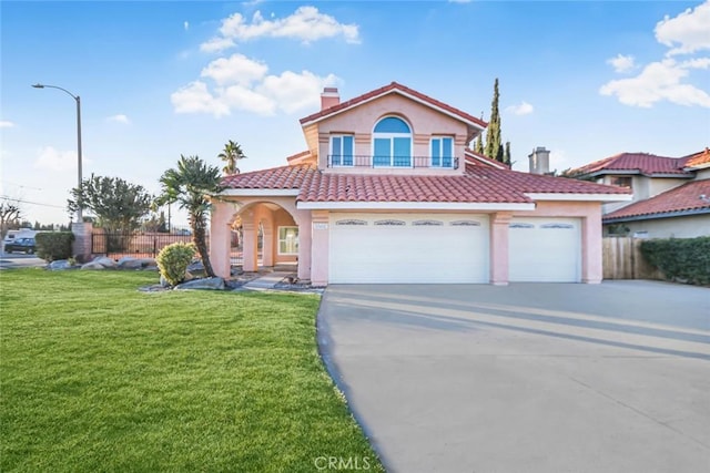 view of front of property featuring a front yard and a garage