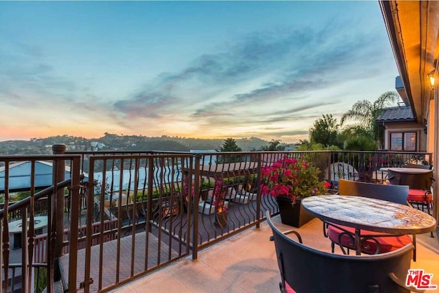 view of balcony at dusk