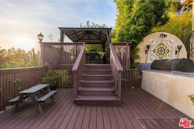 wooden deck featuring a gazebo