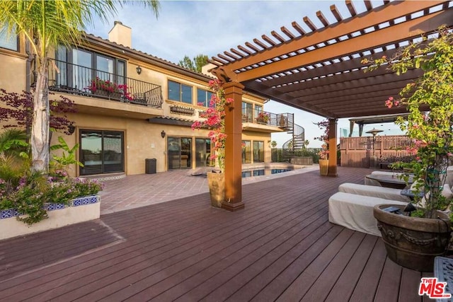 deck featuring a pergola