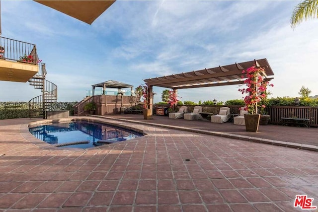 view of swimming pool with a pergola, a patio area, and a jacuzzi