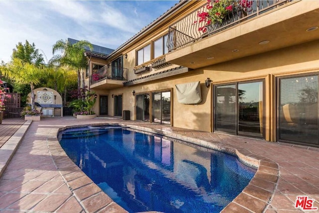 view of pool with a patio area