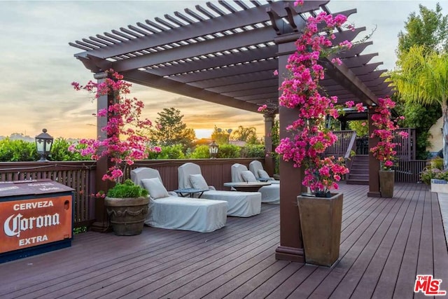 deck at dusk with a pergola