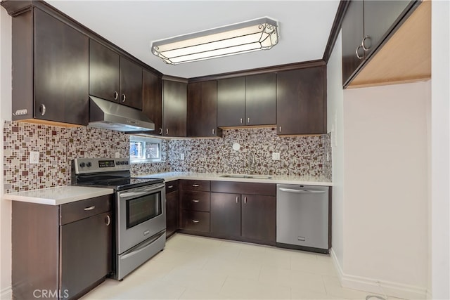 kitchen with appliances with stainless steel finishes, dark brown cabinetry, and sink