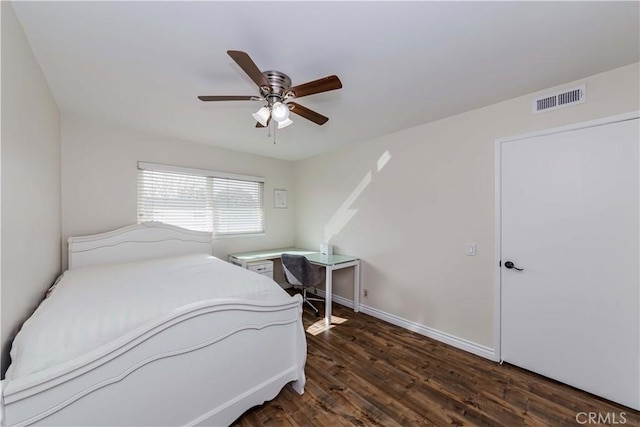 bedroom with baseboards, visible vents, ceiling fan, and wood finished floors