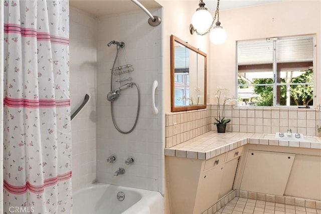 bathroom with tile patterned flooring, backsplash, and shower / bath combo with shower curtain