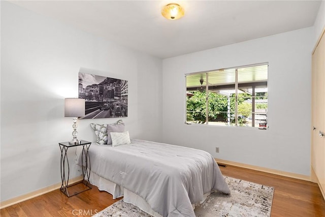 bedroom with hardwood / wood-style flooring