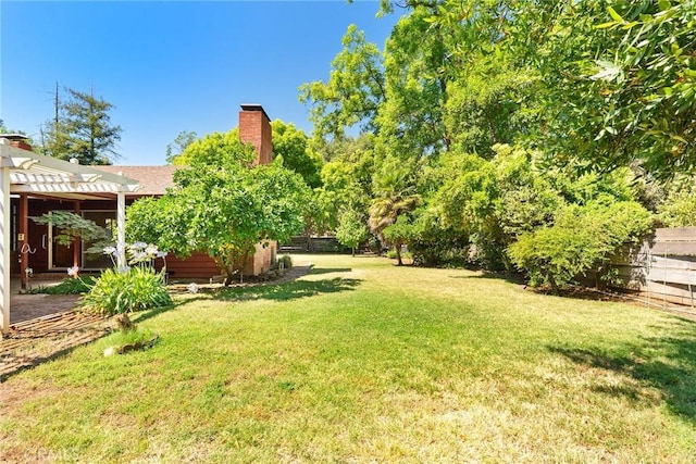 view of yard with a pergola