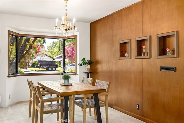 dining room with a notable chandelier