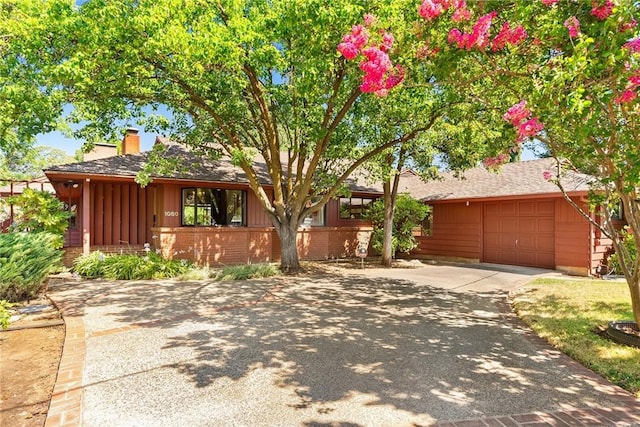 ranch-style home with a garage