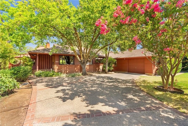 single story home with a garage