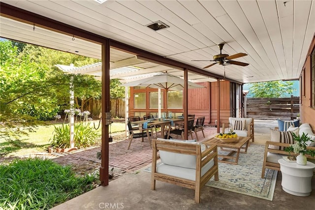 view of patio featuring ceiling fan, a pergola, and an outdoor living space