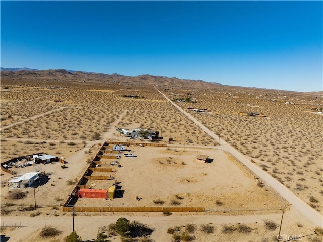 birds eye view of property featuring a mountain view