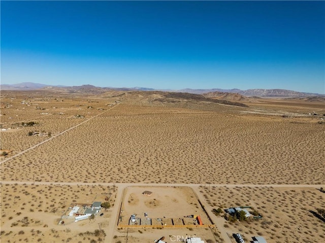 drone / aerial view featuring a mountain view