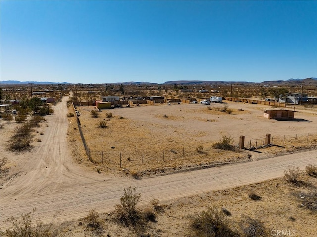 birds eye view of property with a rural view and a mountain view