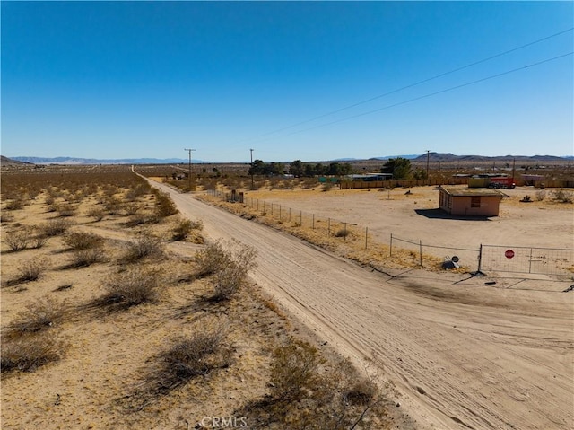 view of street with a mountain view and a rural view