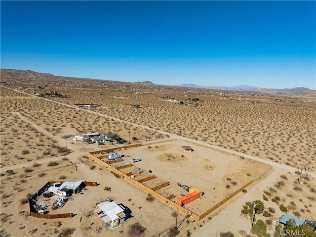 birds eye view of property featuring a mountain view