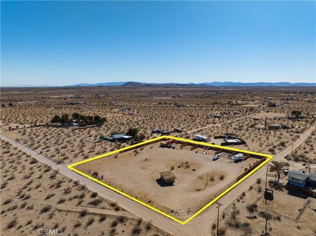 birds eye view of property with a mountain view