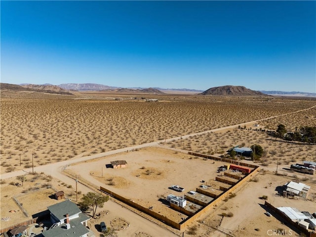 birds eye view of property with a mountain view