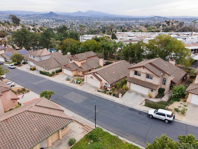 birds eye view of property with a mountain view