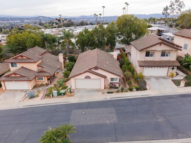 birds eye view of property featuring a mountain view