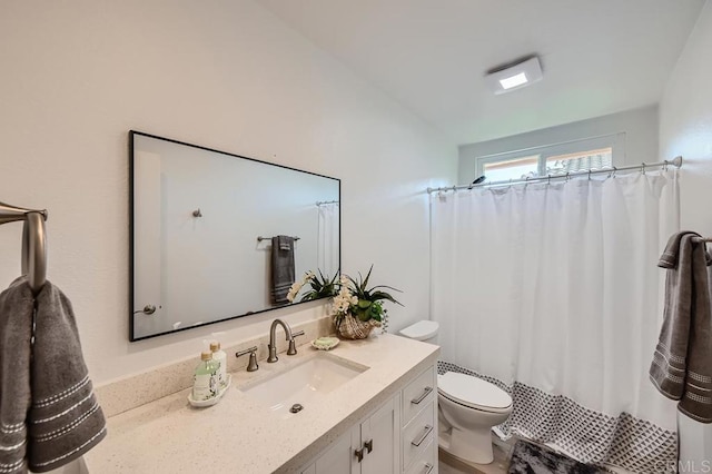 bathroom with toilet, a shower with shower curtain, and vanity