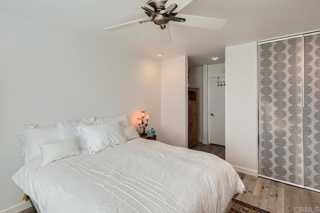 bedroom featuring ceiling fan and wood-type flooring