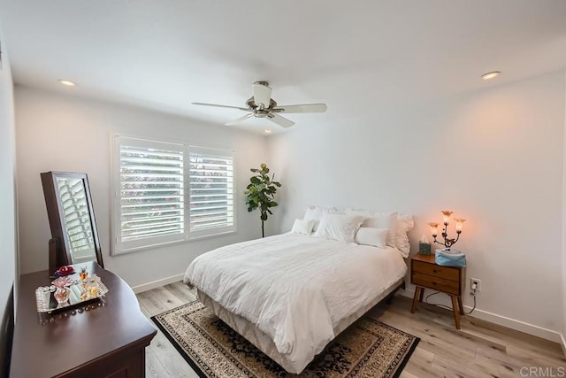 bedroom featuring ceiling fan and light hardwood / wood-style flooring