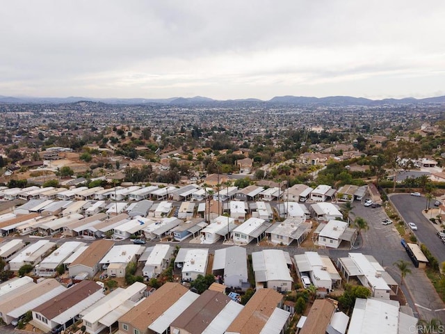 birds eye view of property featuring a mountain view