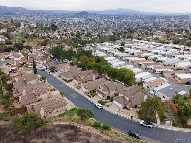 birds eye view of property with a mountain view