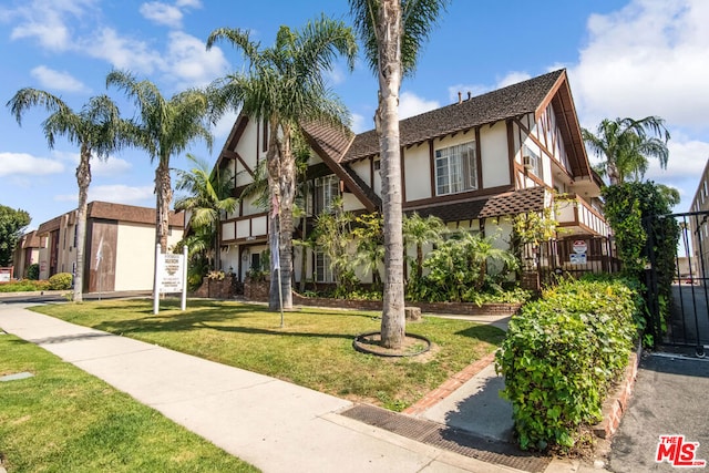 tudor house with a front lawn