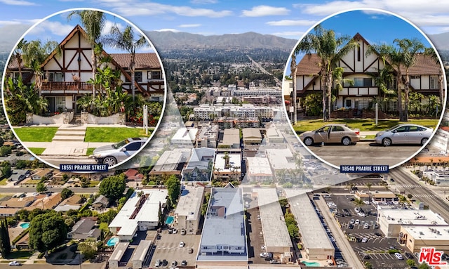 drone / aerial view featuring a mountain view