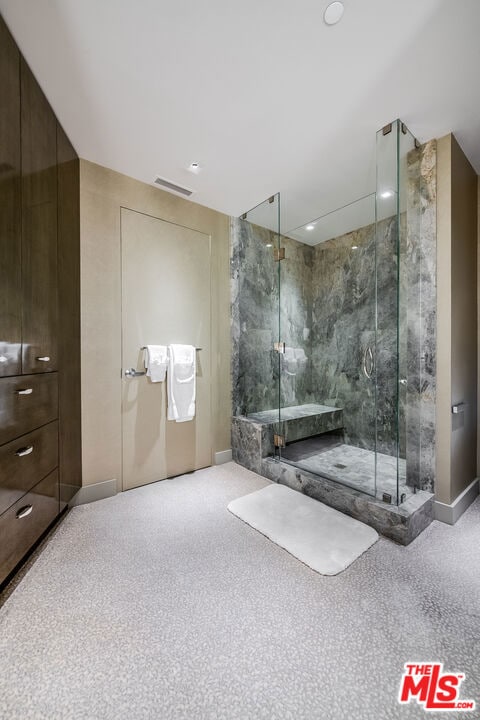 bathroom featuring an enclosed shower