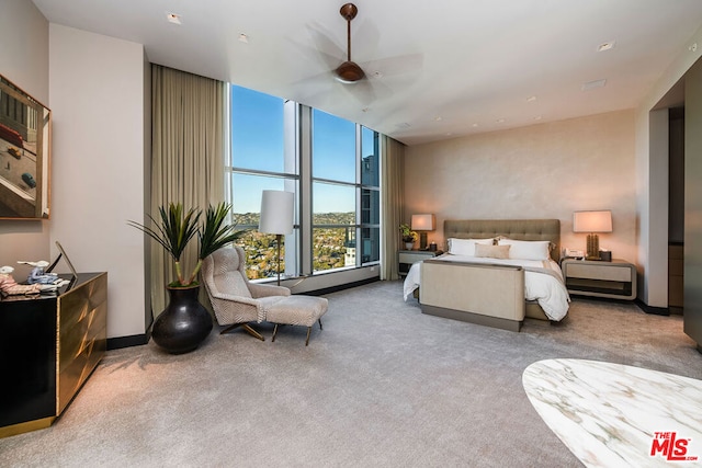 bedroom with ceiling fan and carpet flooring