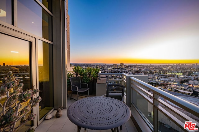 view of balcony at dusk