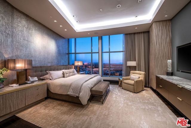 bedroom with floor to ceiling windows