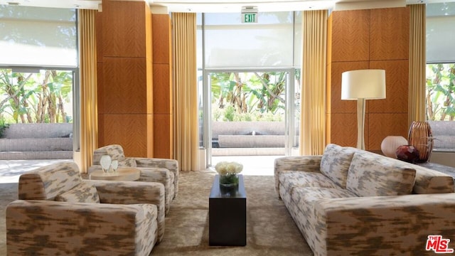 living room with carpet flooring and expansive windows