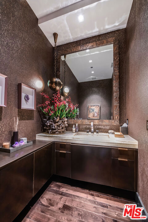 interior space with sink and dark brown cabinets