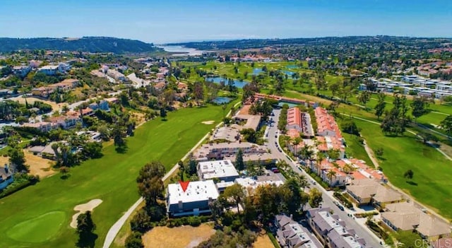 aerial view featuring a water and mountain view