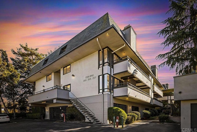 view of outdoor building at dusk