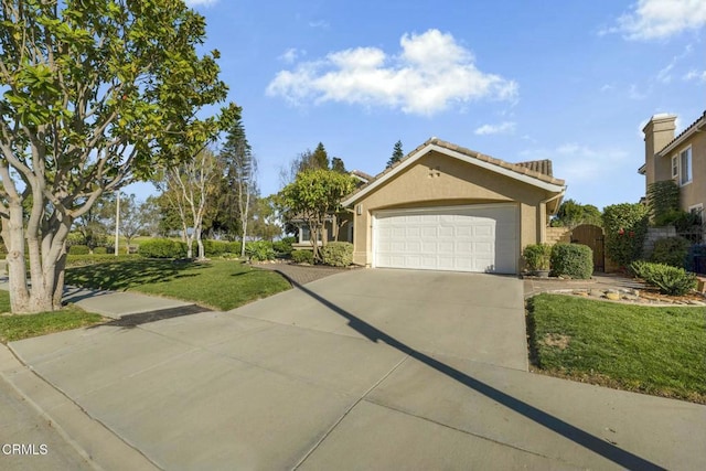 view of front of home with a garage and a front yard