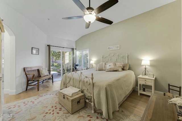 bedroom with access to outside, lofted ceiling, ceiling fan, and light hardwood / wood-style flooring