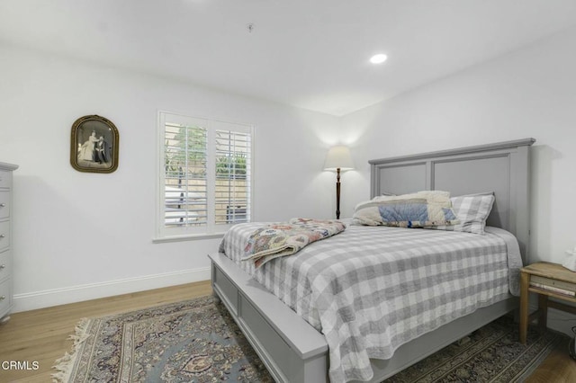 bedroom with wood-type flooring