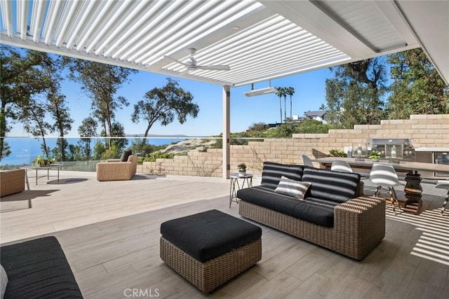 view of patio with ceiling fan and an outdoor living space