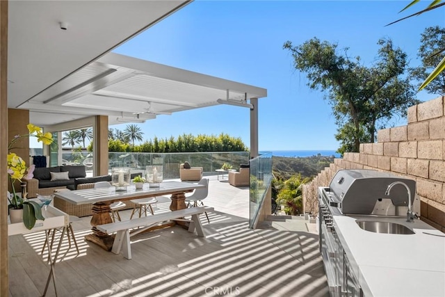 view of patio with exterior kitchen and an outdoor living space